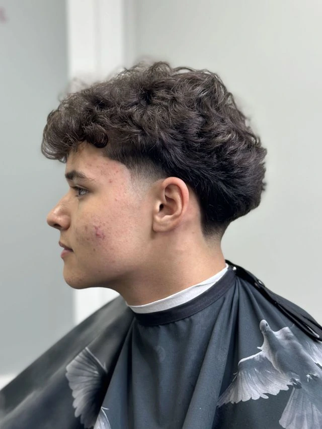 Natural curly taper fade haircut at JTZCUTZ