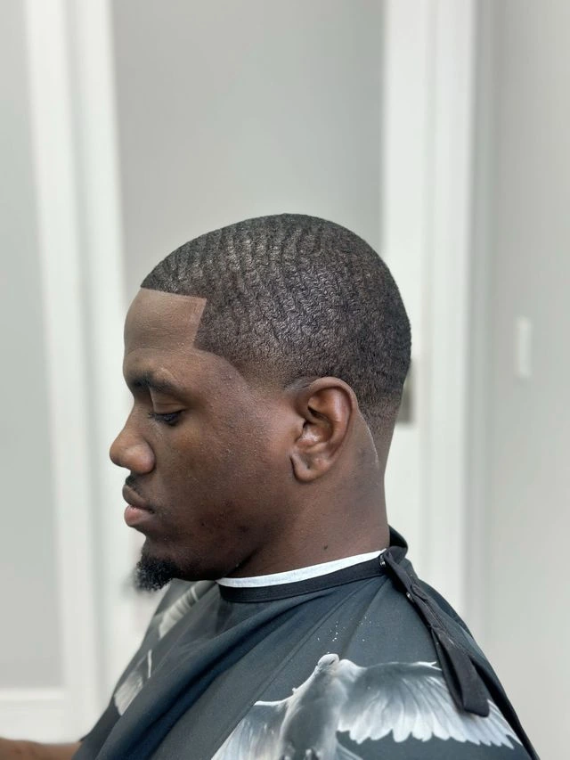 360 Waves haircut with crisp taper side profile at JTZCUTZ